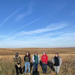 College students walk the Willa Cather Memorial Prairie.