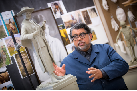 Sculptor Littleton Alston with a clay miniature of the Willa Cather statue