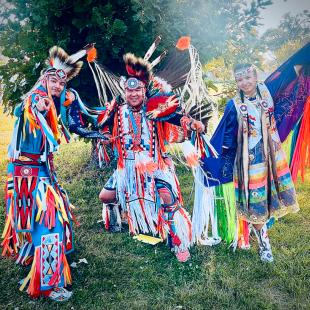 Garan Coons and dancers in regalia