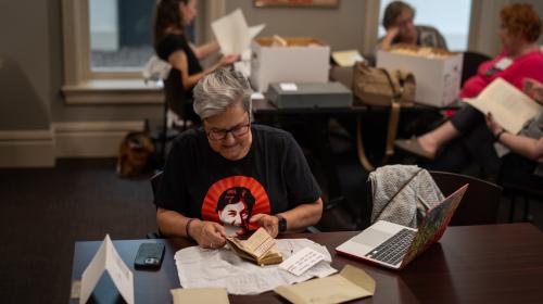 Teachers and students examine primary sources in the archives