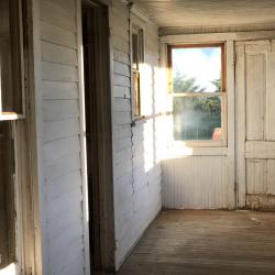 Porch of the Pavelka Farmstead before renovation.