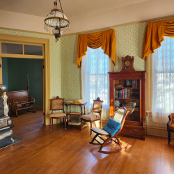 Parlor and downstairs bedroom at Willa Cather Childhood Home