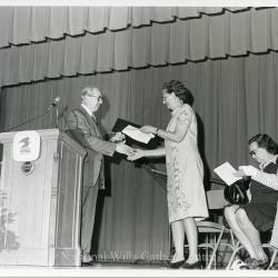 Mildred Bennett accepts First Day of Issue stamp