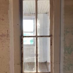 A window at the Pavelka Farmstead pre-renovation.