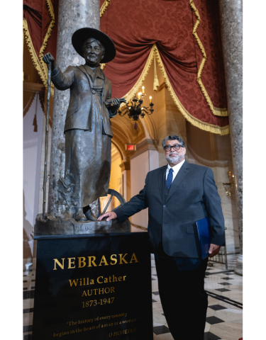 Littleton Alston with his sculpture of Willa Cather