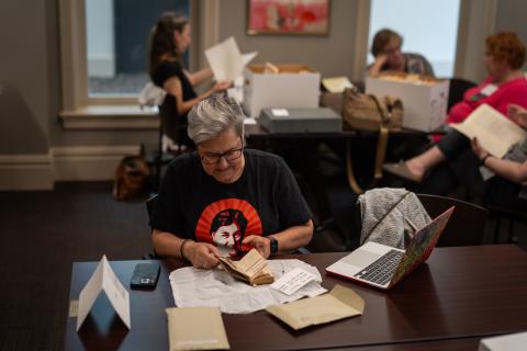 Teachers and students examine primary sources in the archives