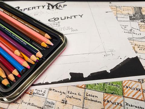 map and colored pencils
